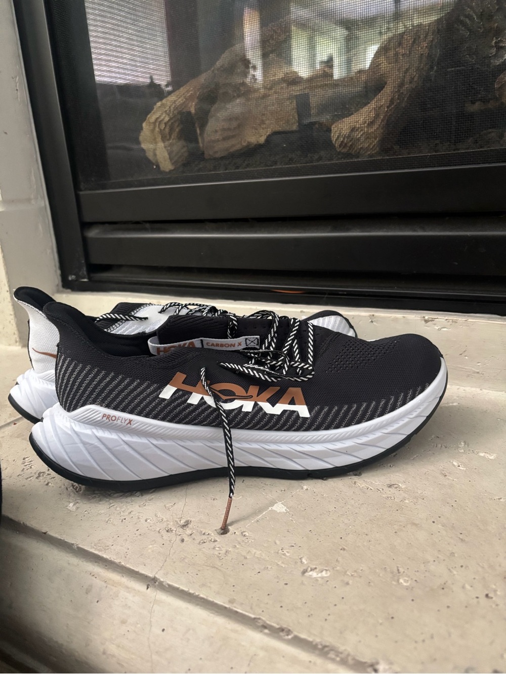 Hoka Men’s Black, White and Copper Carbon X Road-Training Shoes